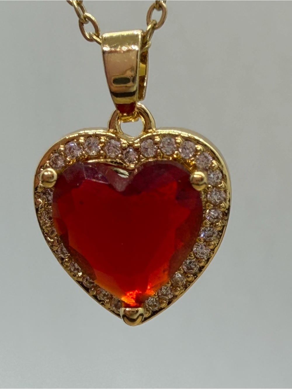 Gold Heart Pendant Necklace with Red Gemstone